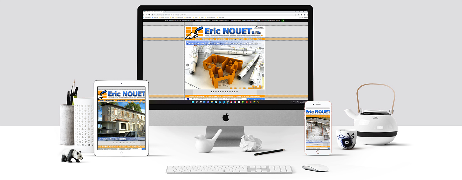 Le site Eric Nouet & fils sur un écran Mac, un écran de tablette et un écran d'Iphone