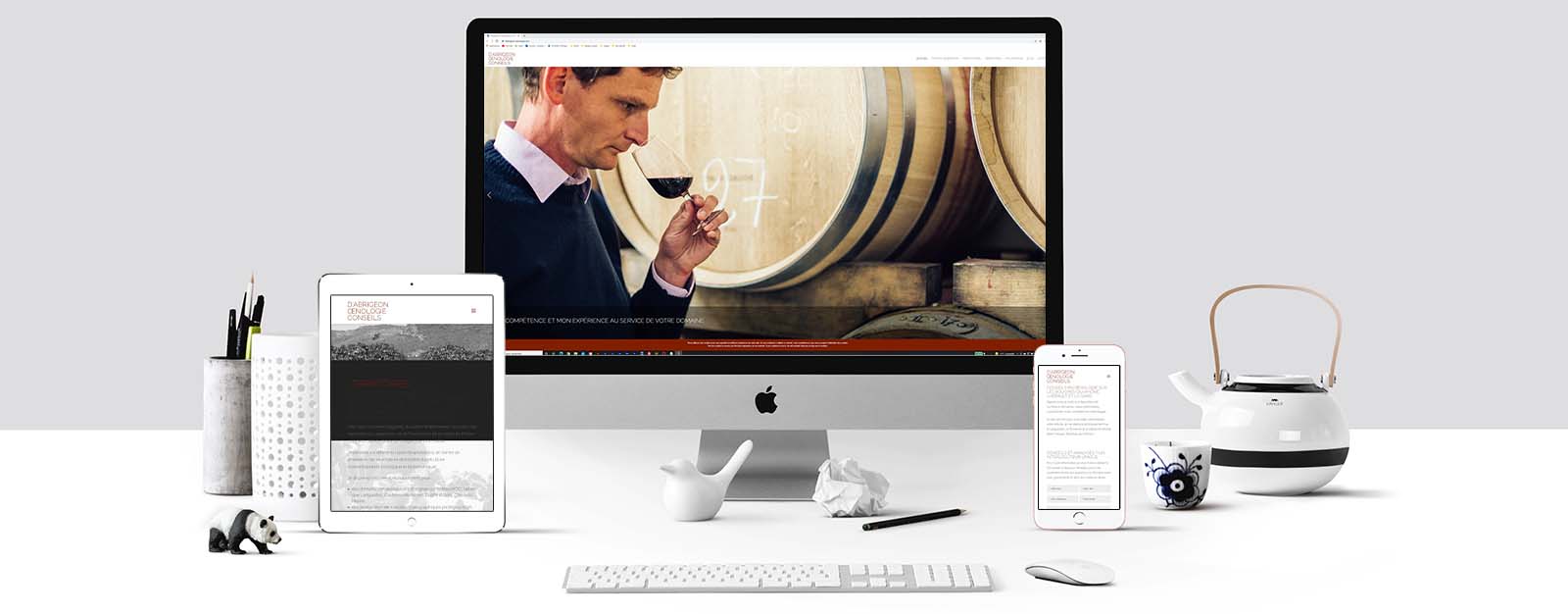 Le site D'Abrigeon œnologie sur un écran Mac, un écran de tablette et un écran d'Iphone