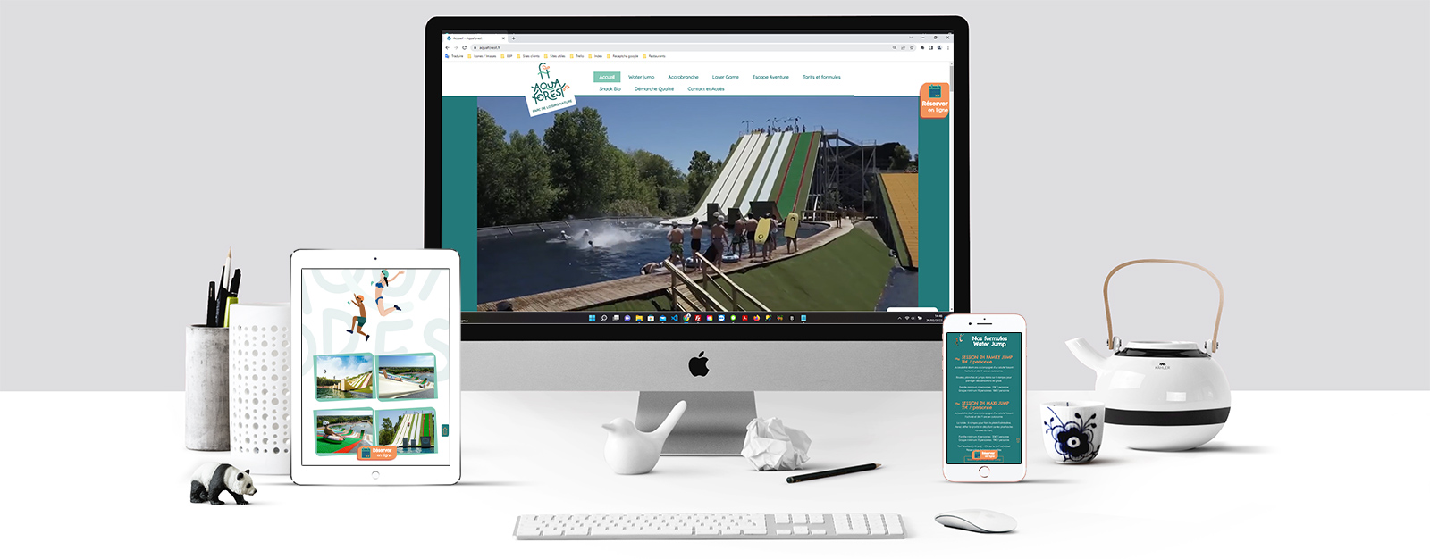Le site Aqua Forest sur un écran Mac, un écran de tablette et un écran d'Iphone