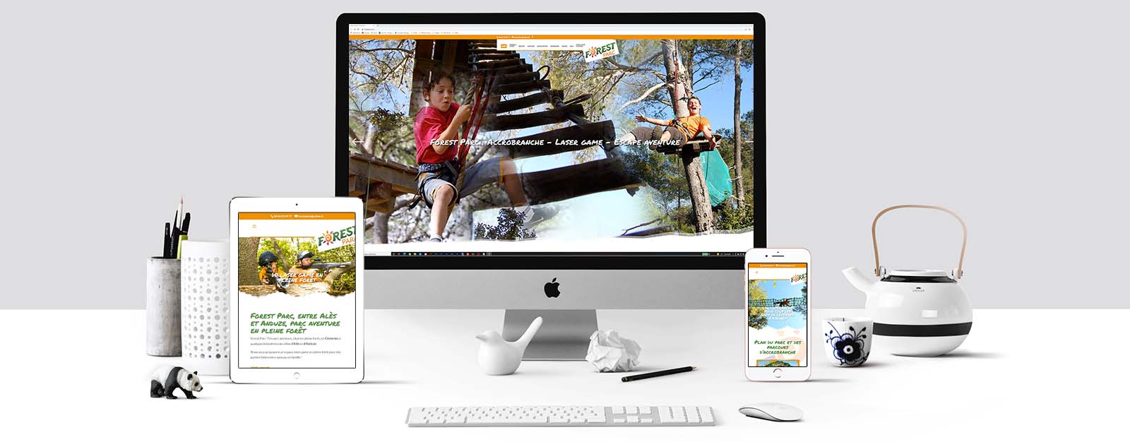 Le site de Forest Parc sur un écran Mac, un écran de tablette et un écran d'Iphone