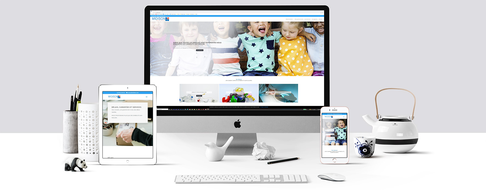 Le site de Midison sur un écran Mac, un écran de tablette et un écran d'Iphone
