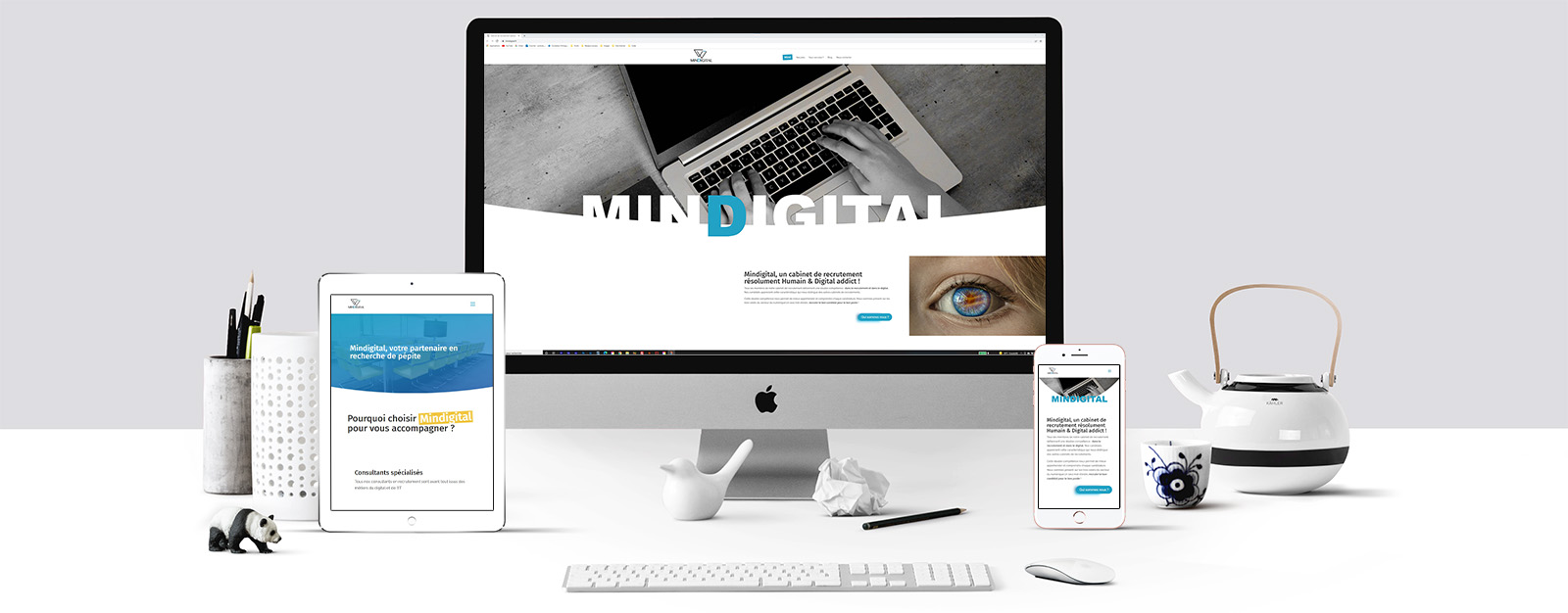 Le site de Mindigital sur un écran Mac, un écran de tablette et un écran d'Iphone sur un écran Mac, un écran de tablette et un écran d'Iphone